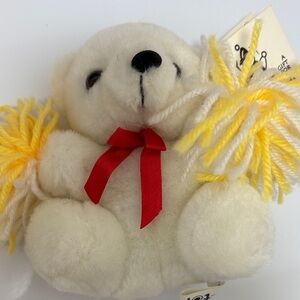 White and Yellow Stuffed Bear with Red Bow